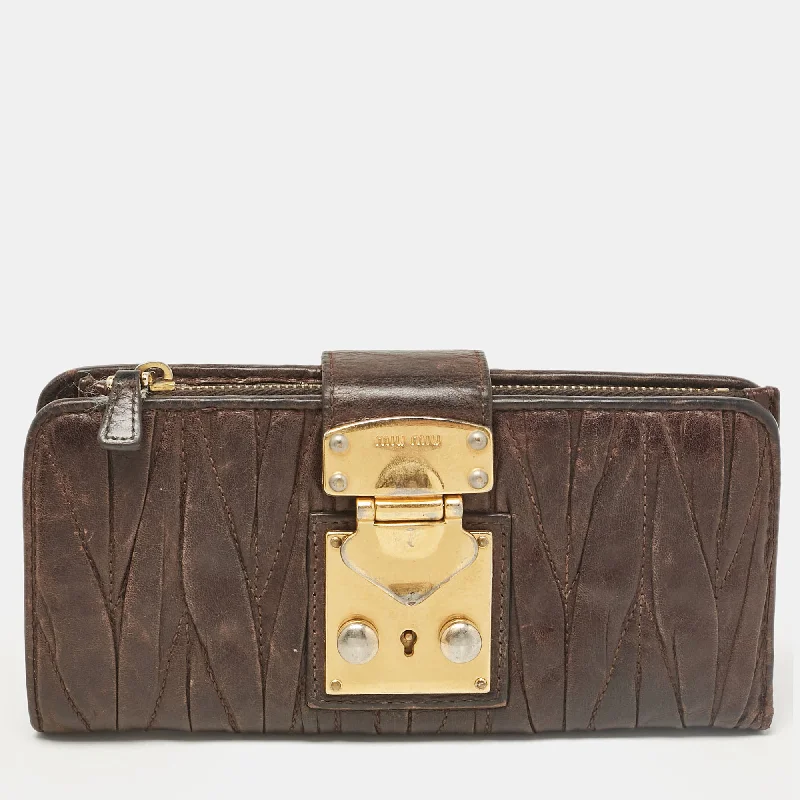 keychains with leather style-Miu Miu Dark Brown Matelassé Leather Clasp Lock Continental Wallet